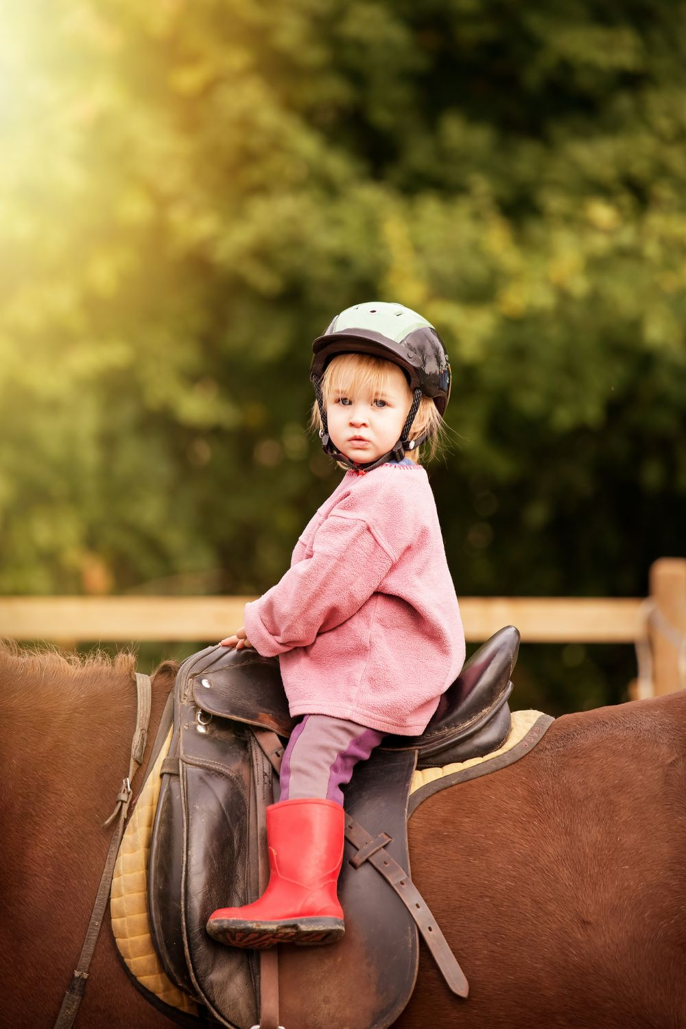 Little girl on horseback - old money families are famous for loving equestrian activities