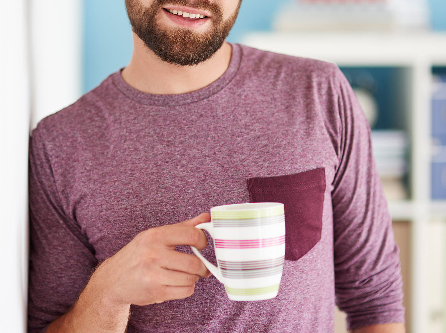 man holding ceramic mug