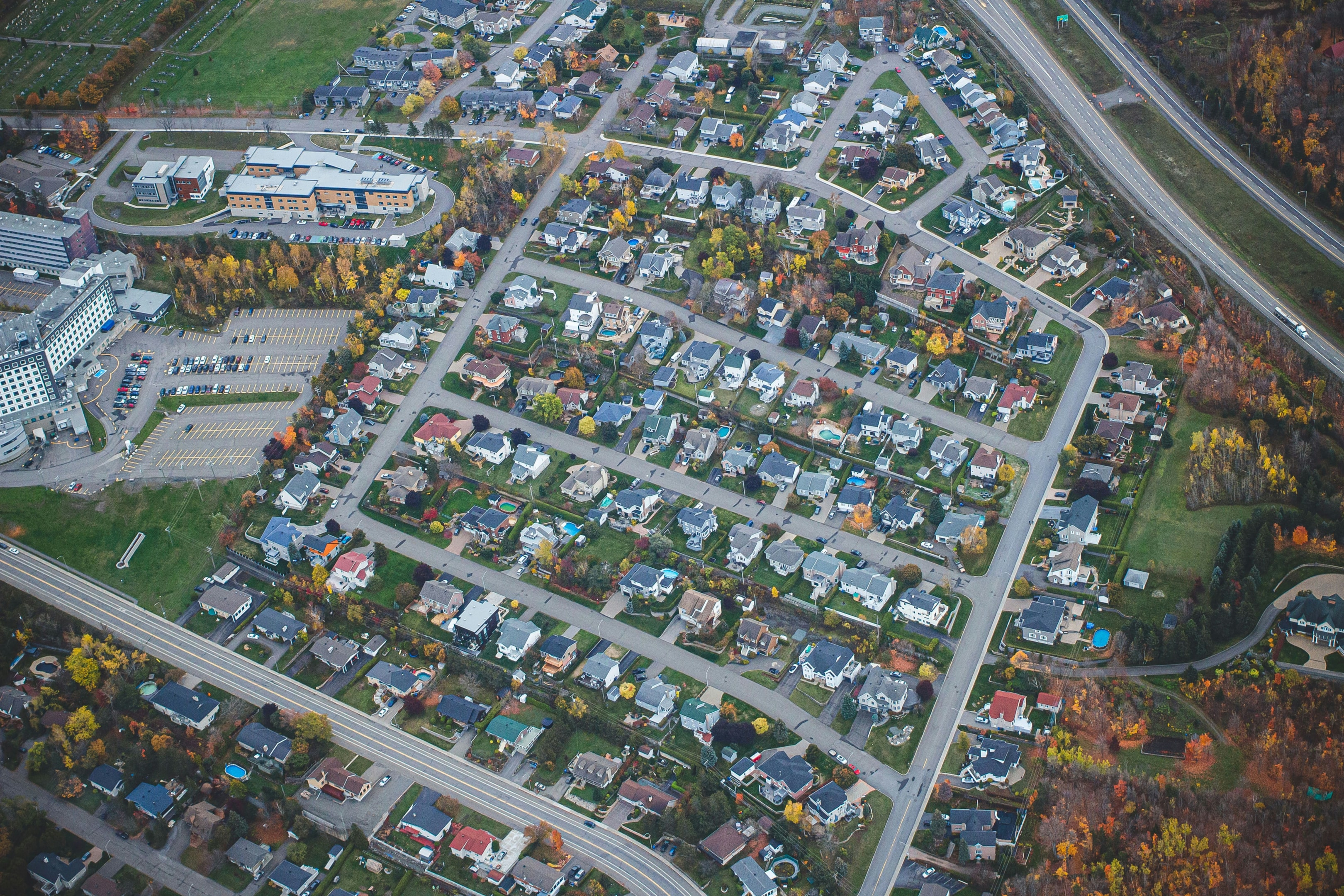 Aerial view of suburban neighborhood that is zoned for residential use.