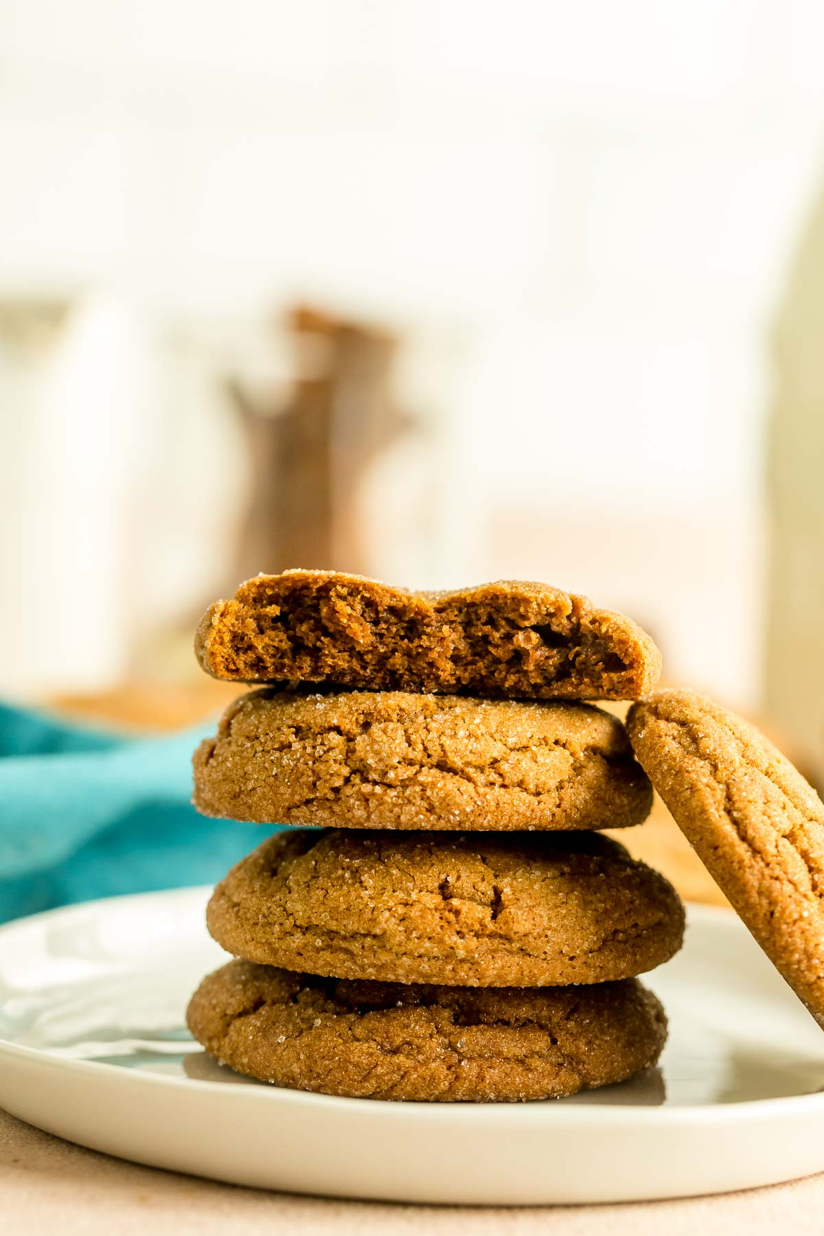 five molasses cookies on a white plate