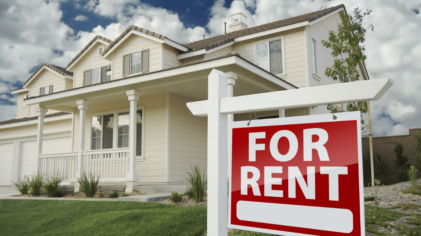 Exterior of a rental property with rent signs displayed, showing how a great rental listing, the right rent price, and strong online listings help properties stand out.