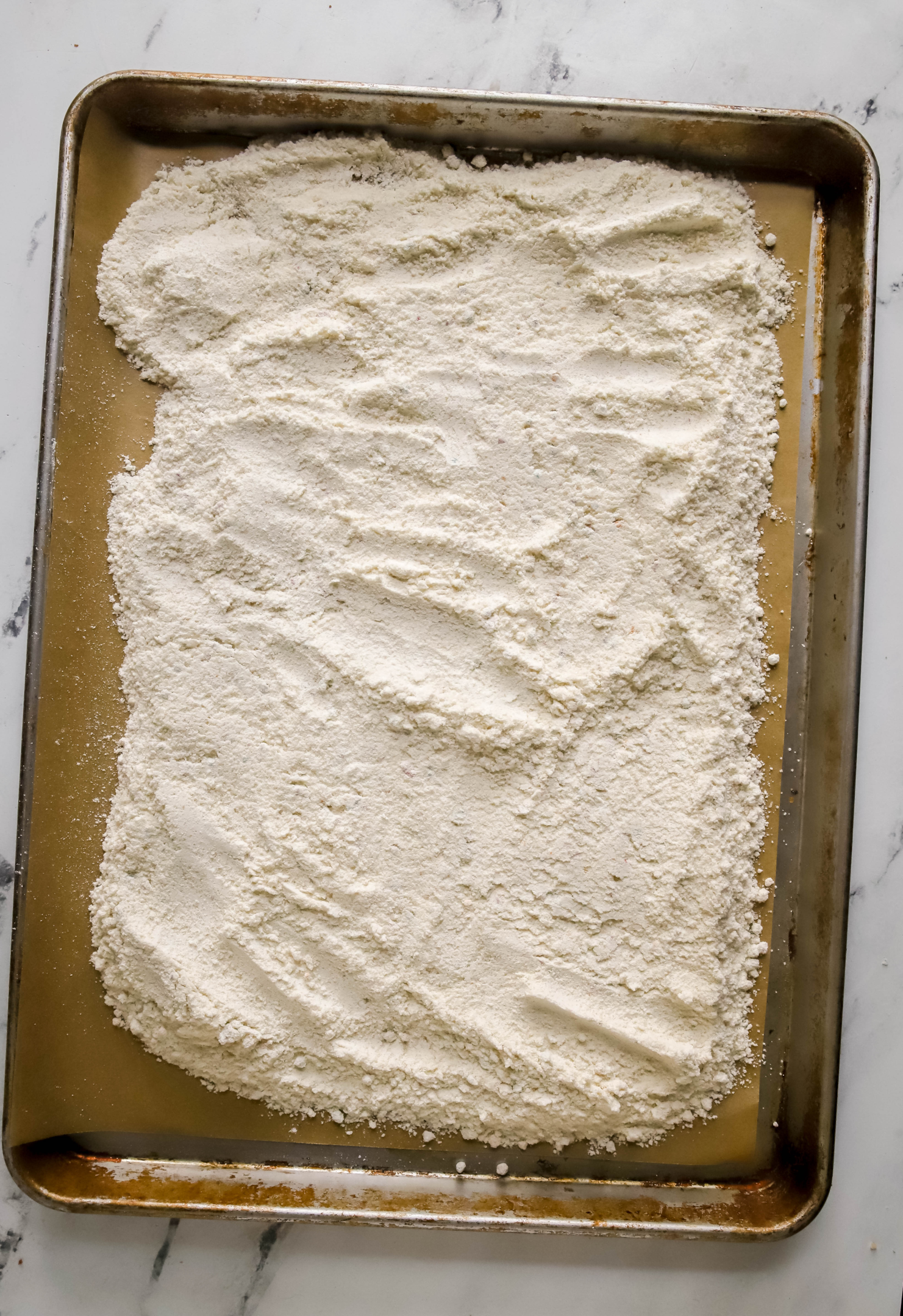 raw cake mix on a cookie sheet