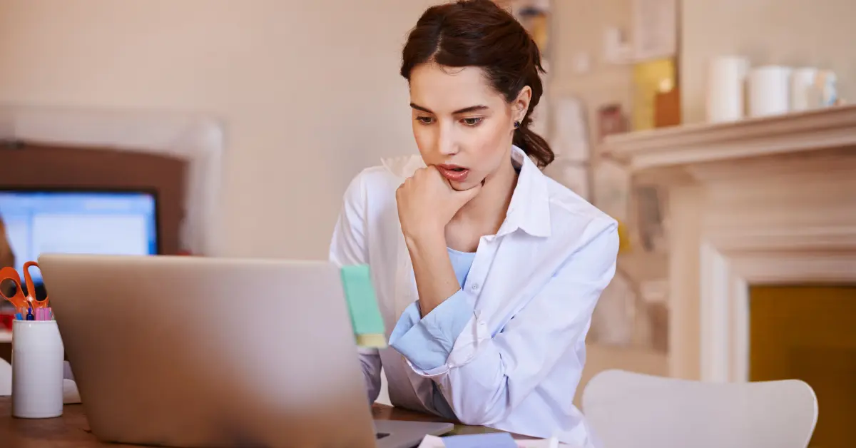 A woman accessing the IRS website to download a digital tax transcript for OnlyFans business records.