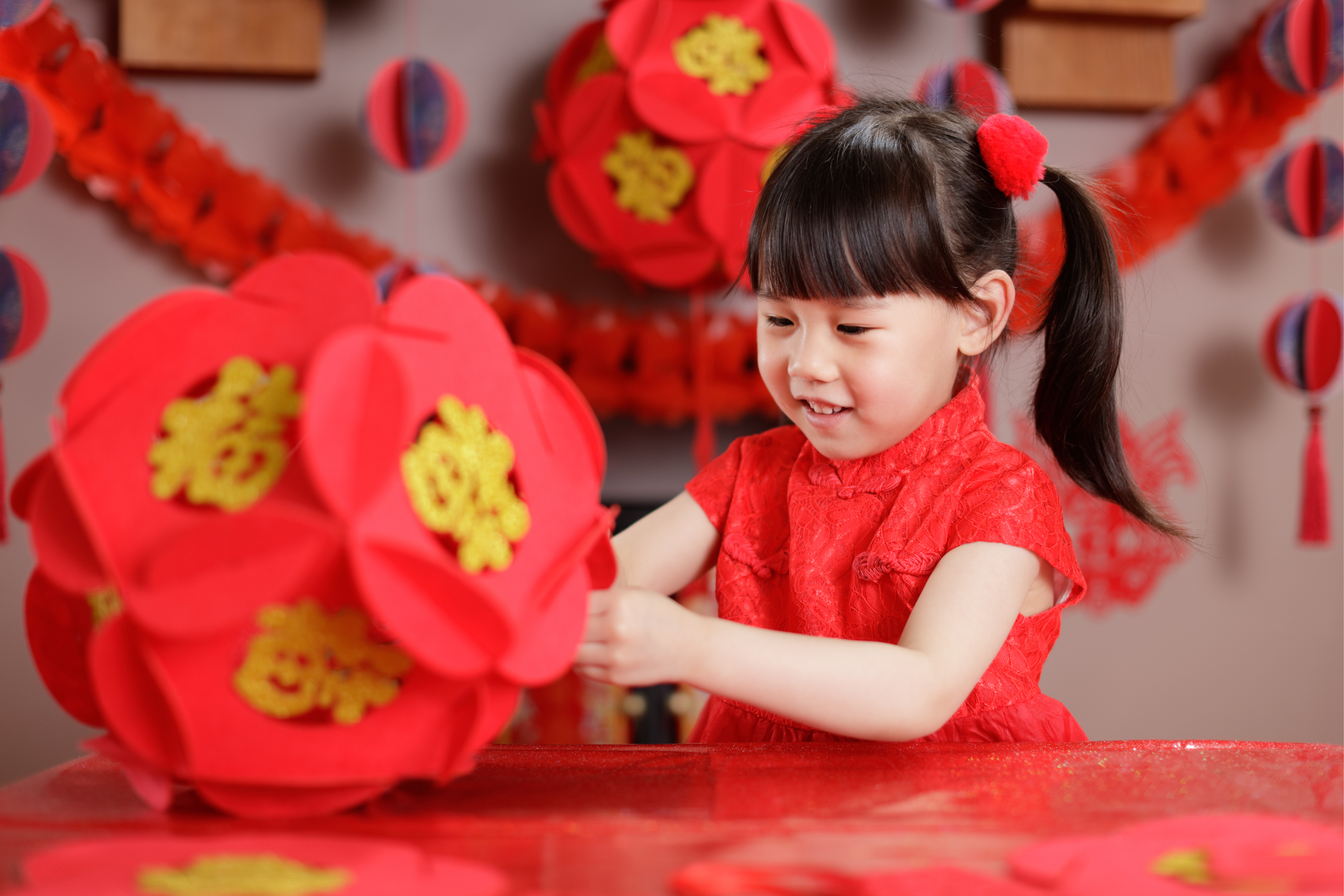 A young girl with Chinese New Year decorations