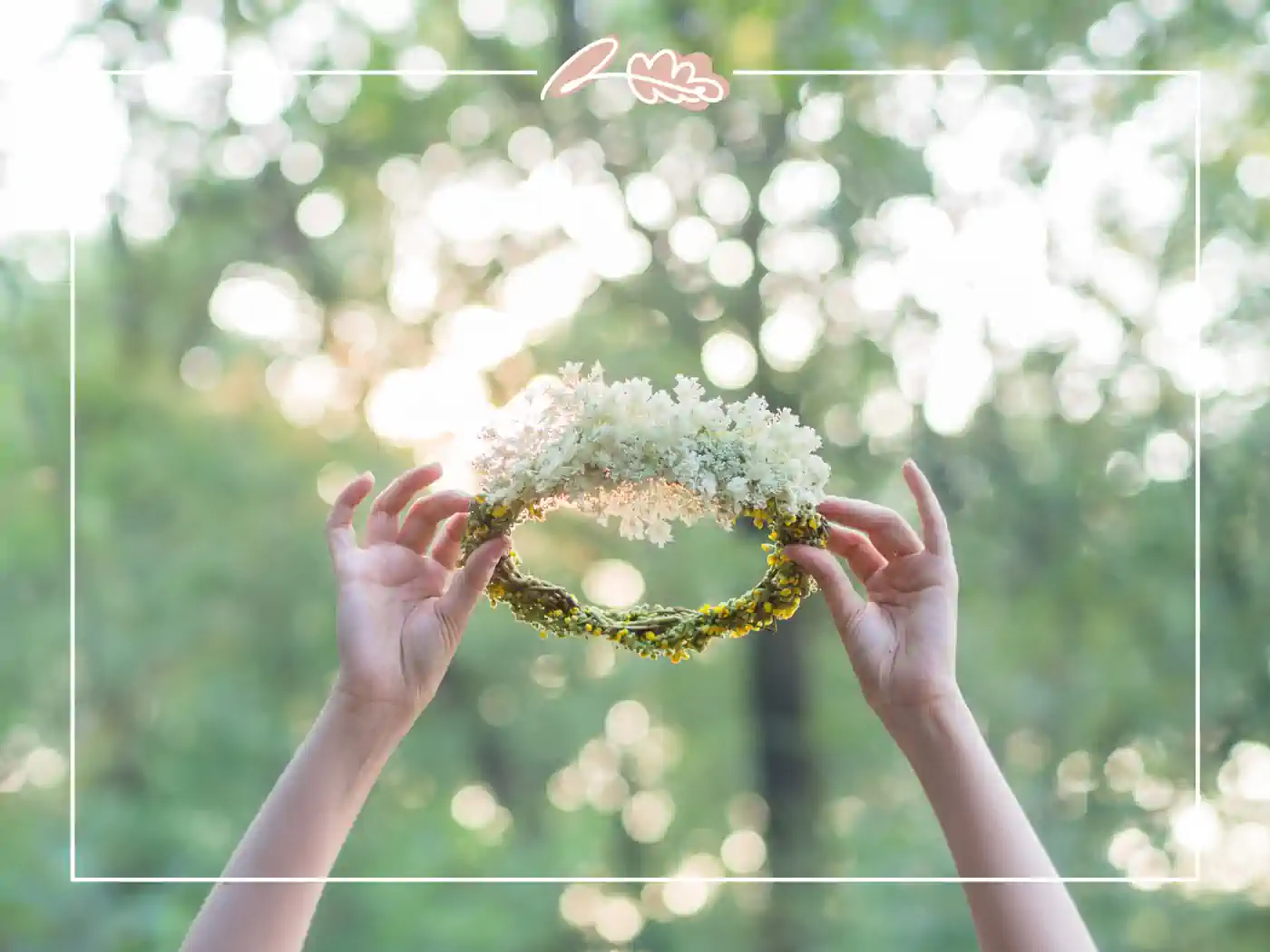 Hands holding a floral crown against a background of greenery and sunlight. Woodland Fairy Floral Crown by Fabulous Flowers and Gifts.