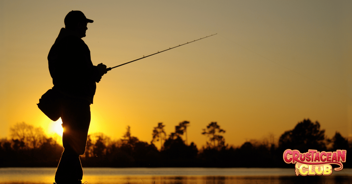 The silhouette of a man fishing 