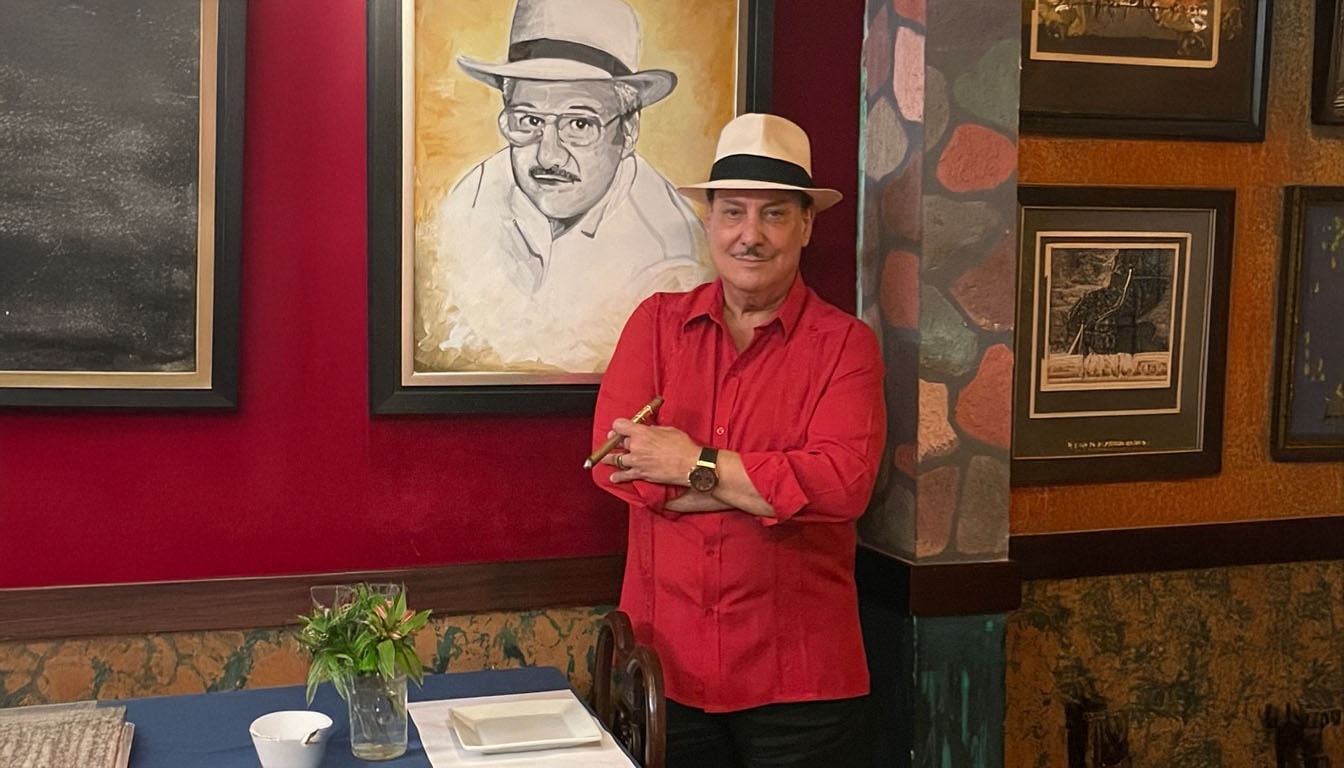 A close-up of Carlito Fuente with a cigar, reflecting on the artistry of cigar making.