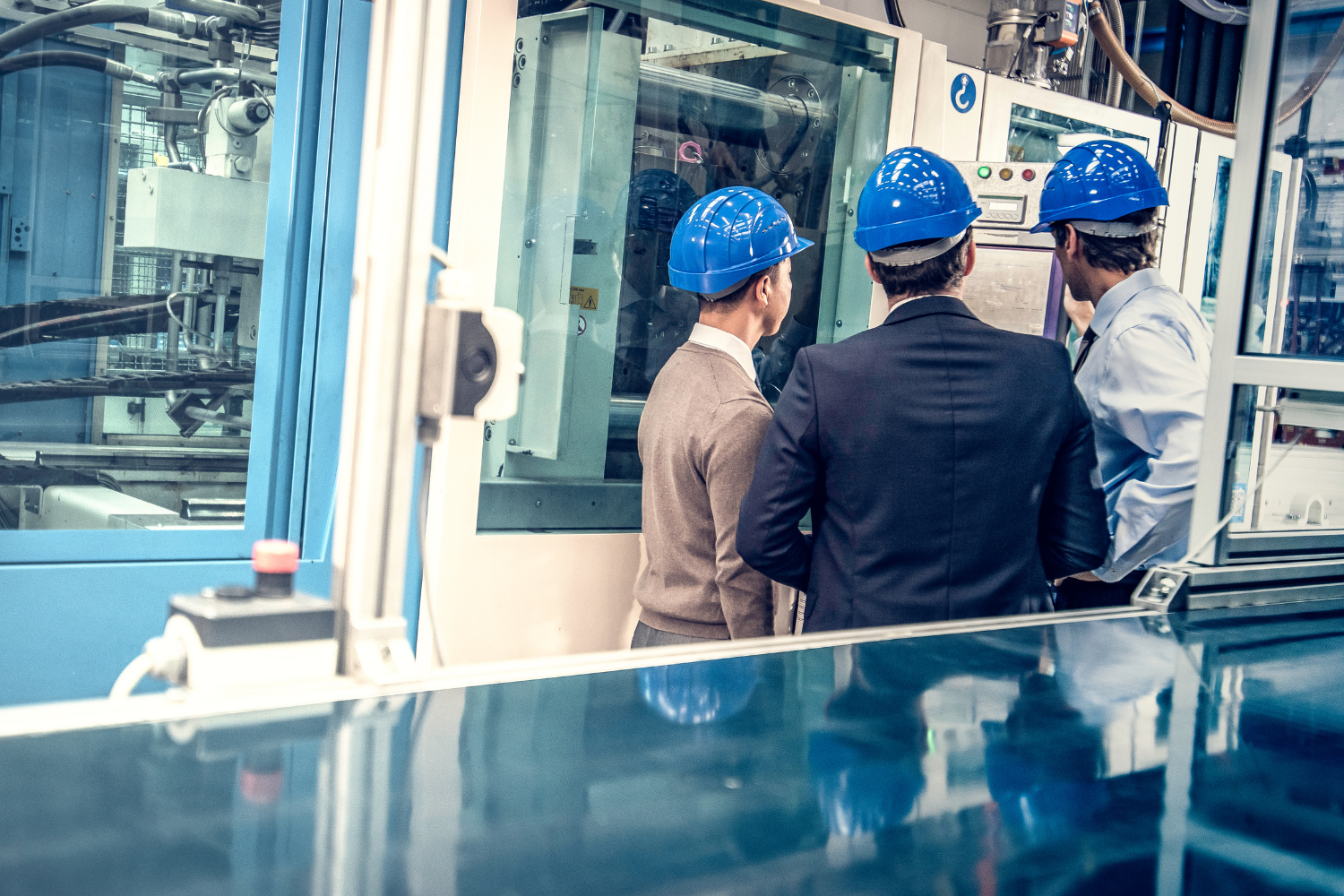 Professionals doing a manufacturing tour.