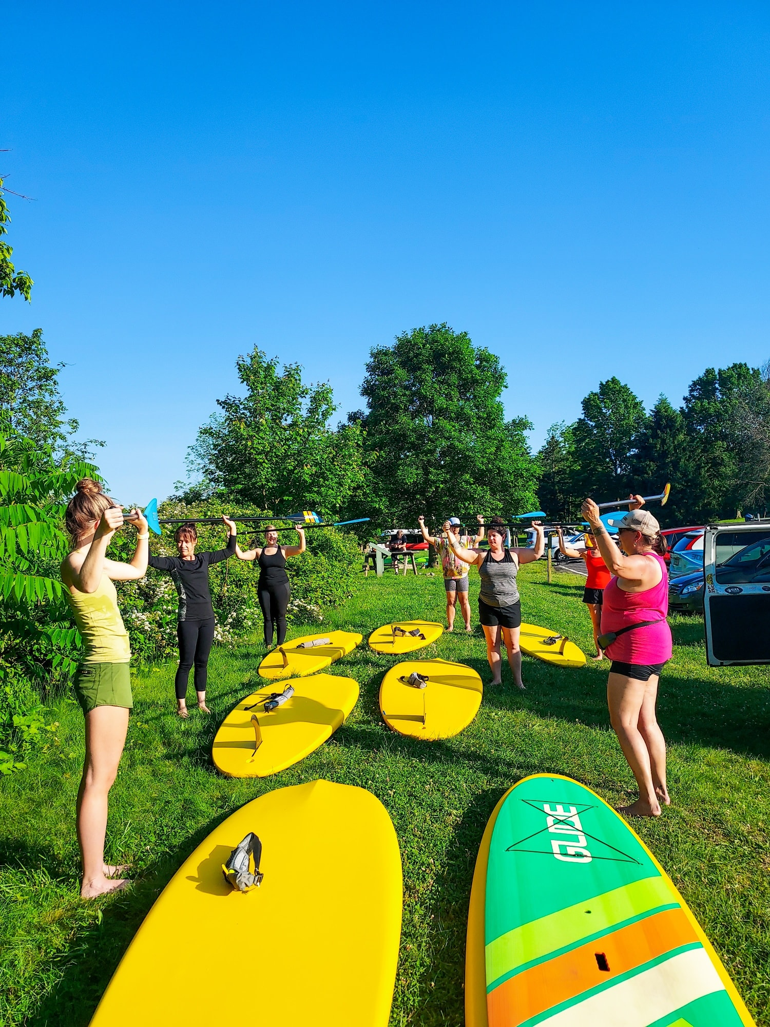 knees slightly bent on stand up paddleboards while doing sup yoga