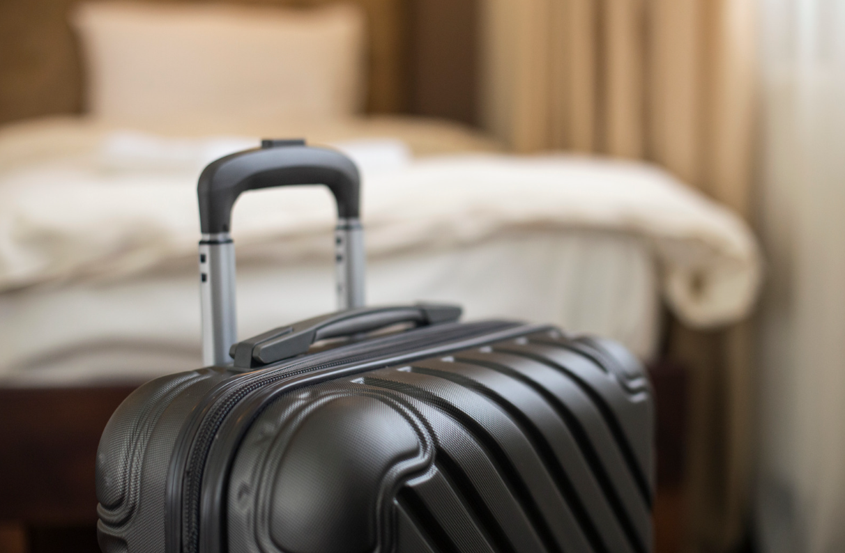 Suitcase sitting in hotel room