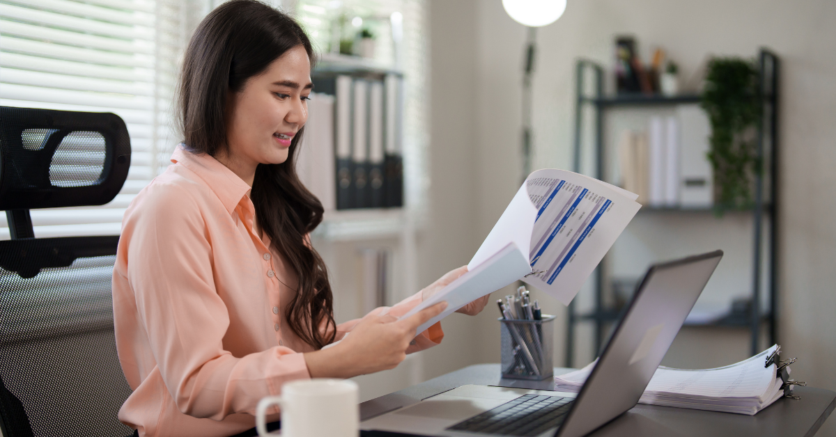 Woman checking payout options and wondering can I use PayPal on OnlyFans while reviewing her income settings.