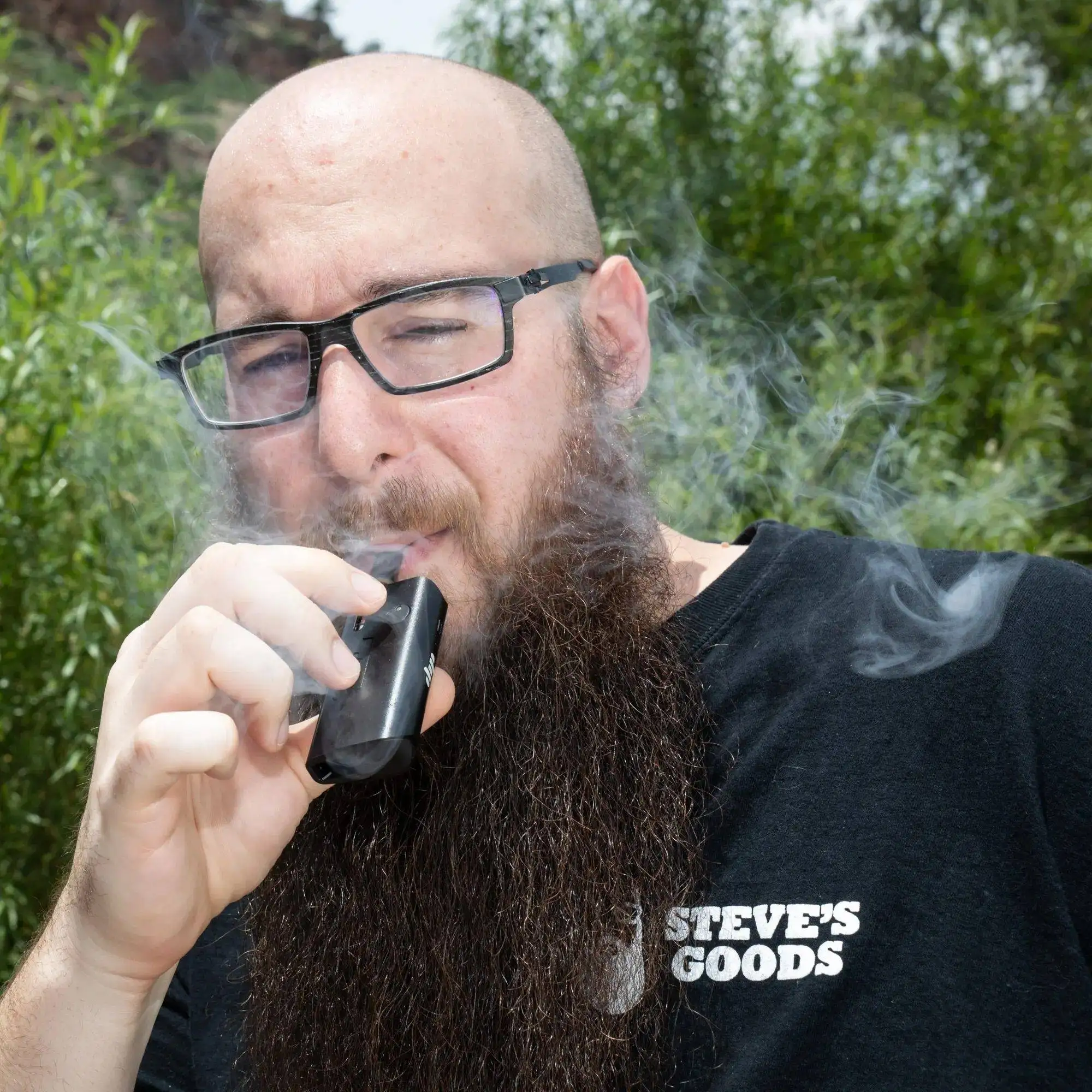 steve from Steve's Goods smoking a vape cartridge with a vape pen