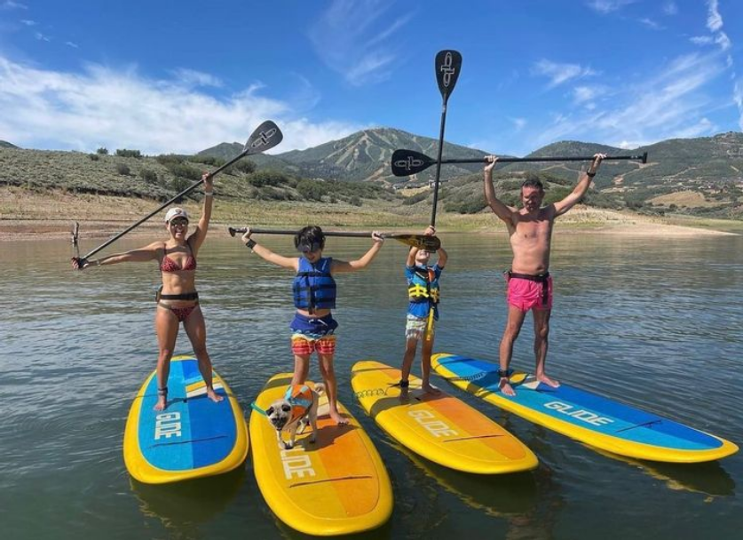 family on paddle boards