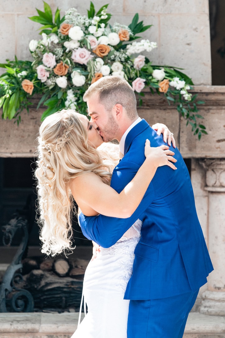 A first kiss, captured at a wedding in Arizona