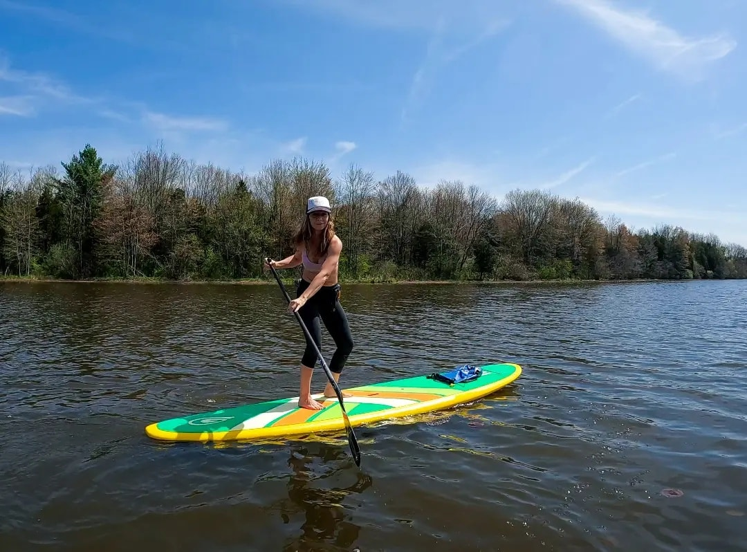 woman paddling a sup board