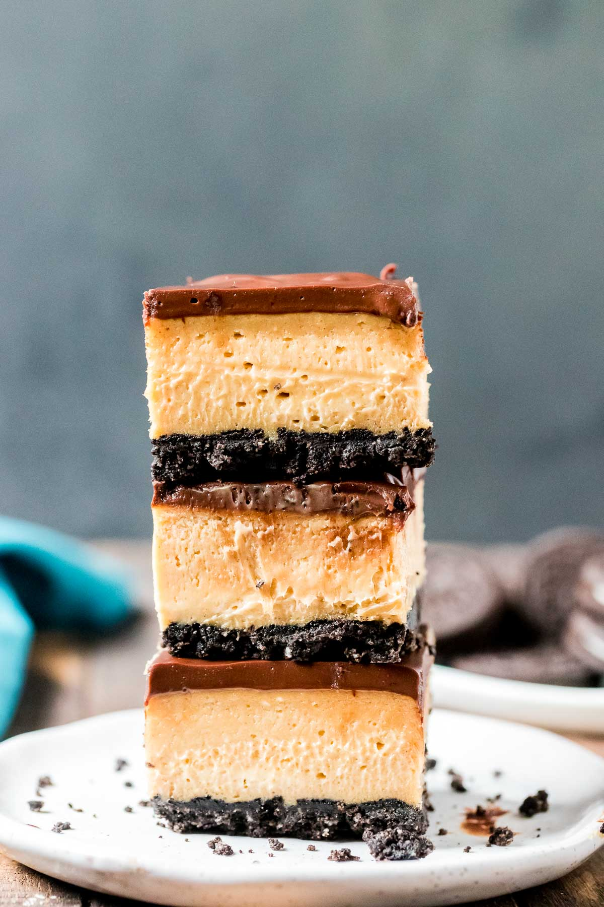 three buckeye cheesecake bars stacked on top of each other