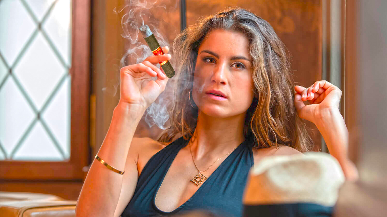 A women smoking a K-Fire, enjoying the flavorful experience
