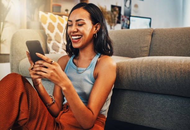 happy woman looking at phone