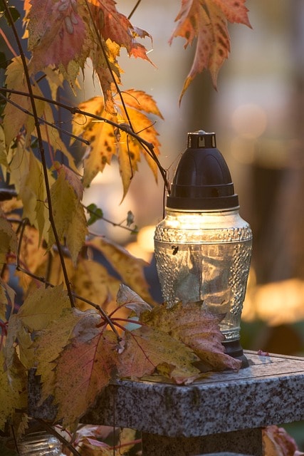 a candle, cemetery, grave