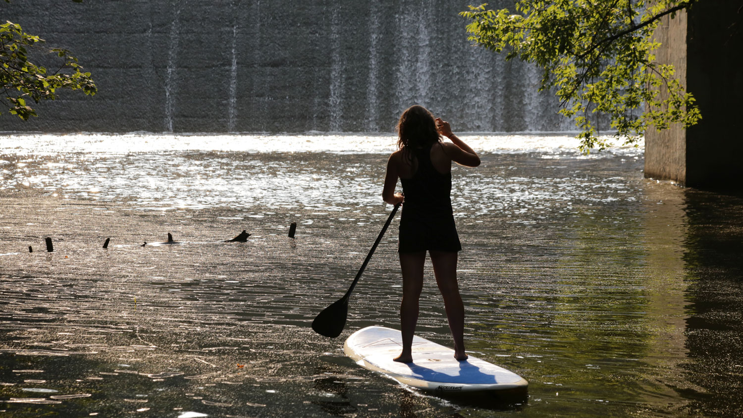 woman on inflatable paddlebord in wisconsin