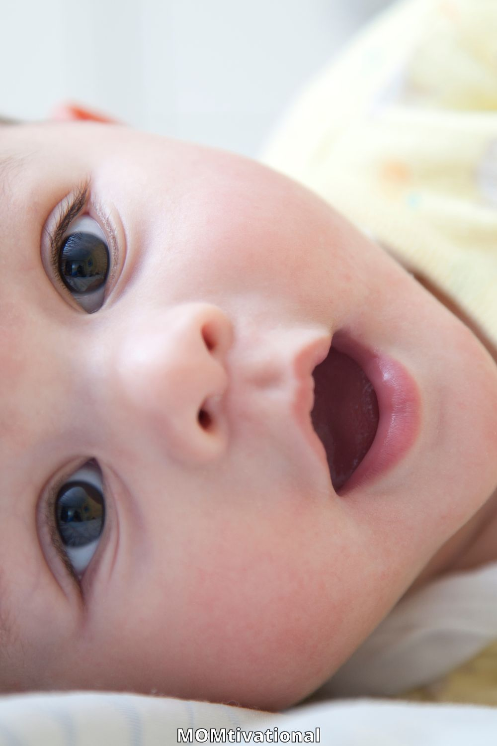 Baby boy smiling at camera