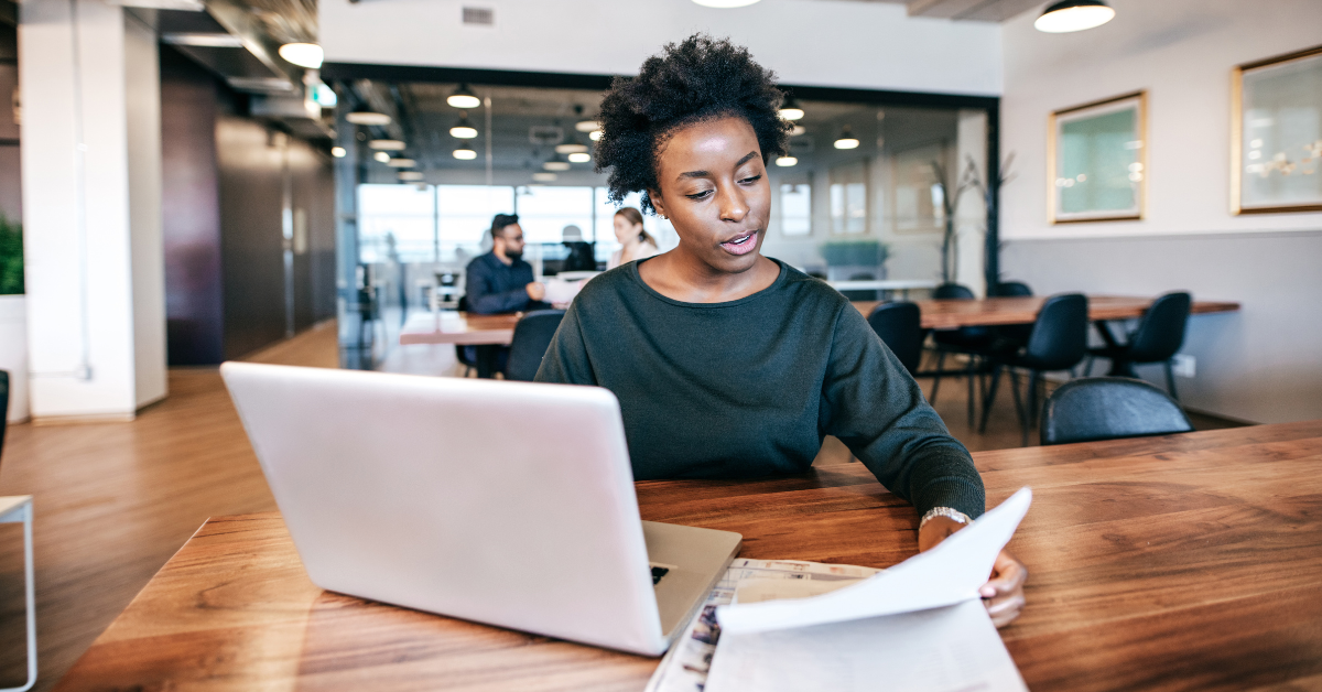 A woman reading about tax or audit