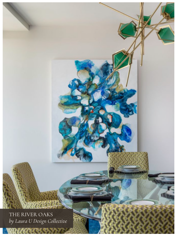 a dining room with art and bold light fixtures; perfect for relaxing at home or hosting after a long day