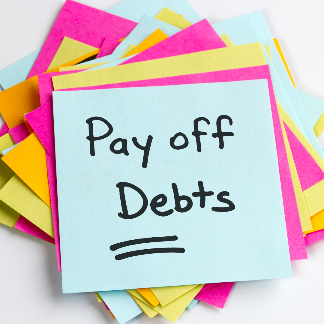 A person considering debt payoff strategies like a debt management program and debt relief programs.