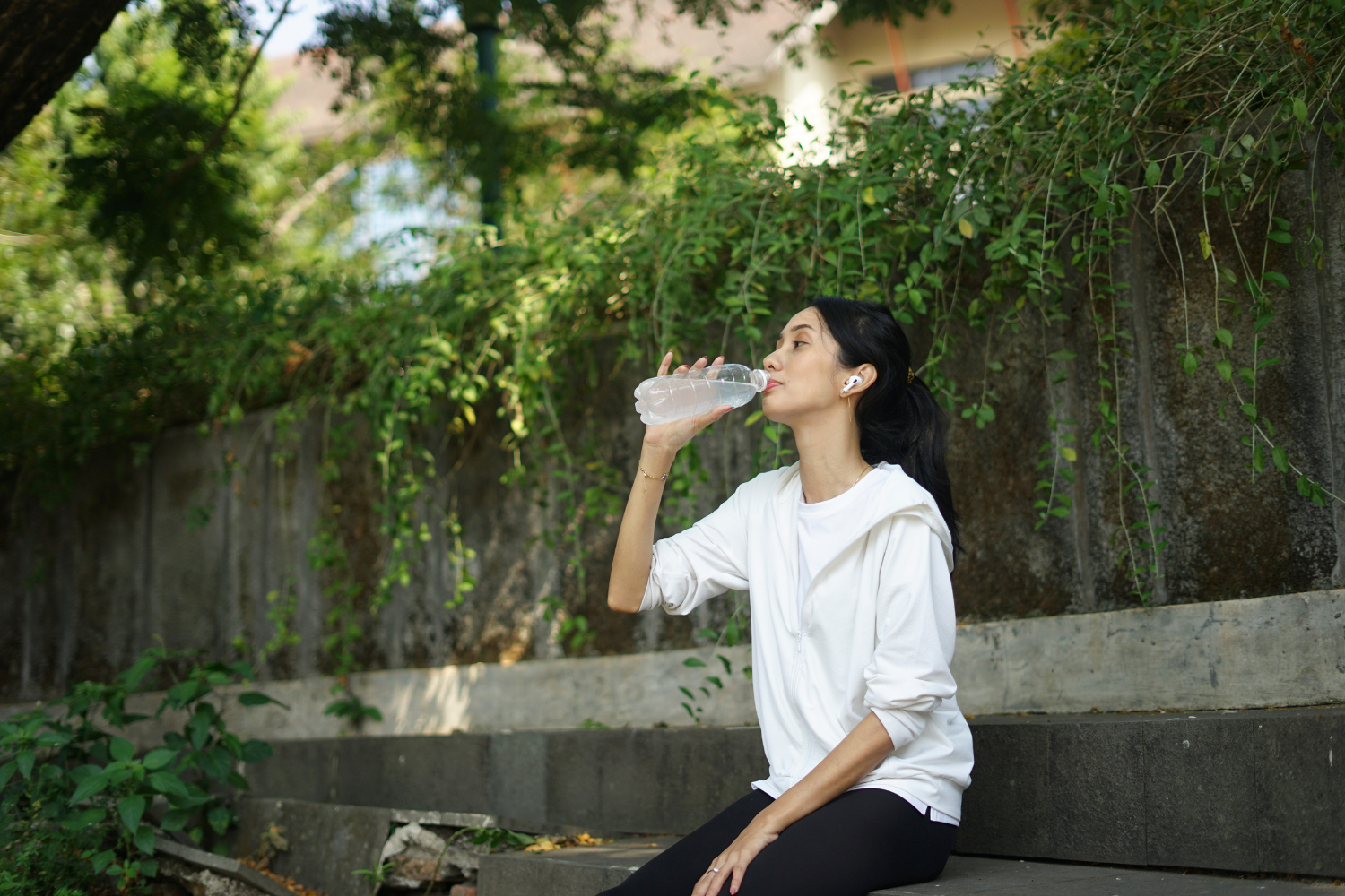 Athlete drinking electrolytes after exercise for hydration.