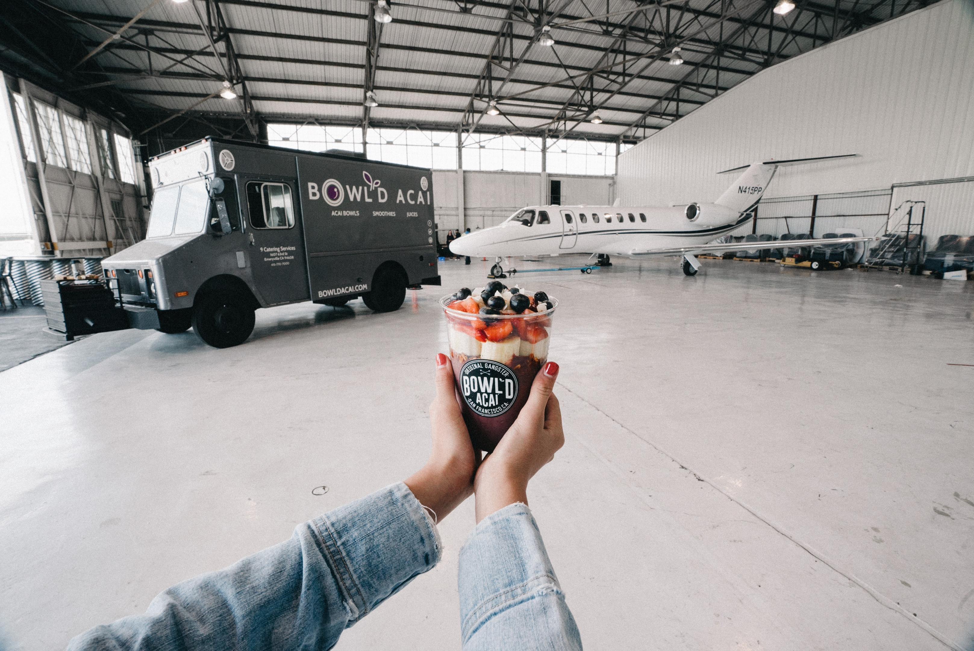 Photo of a yogurt ice cream with jet plane in the background
