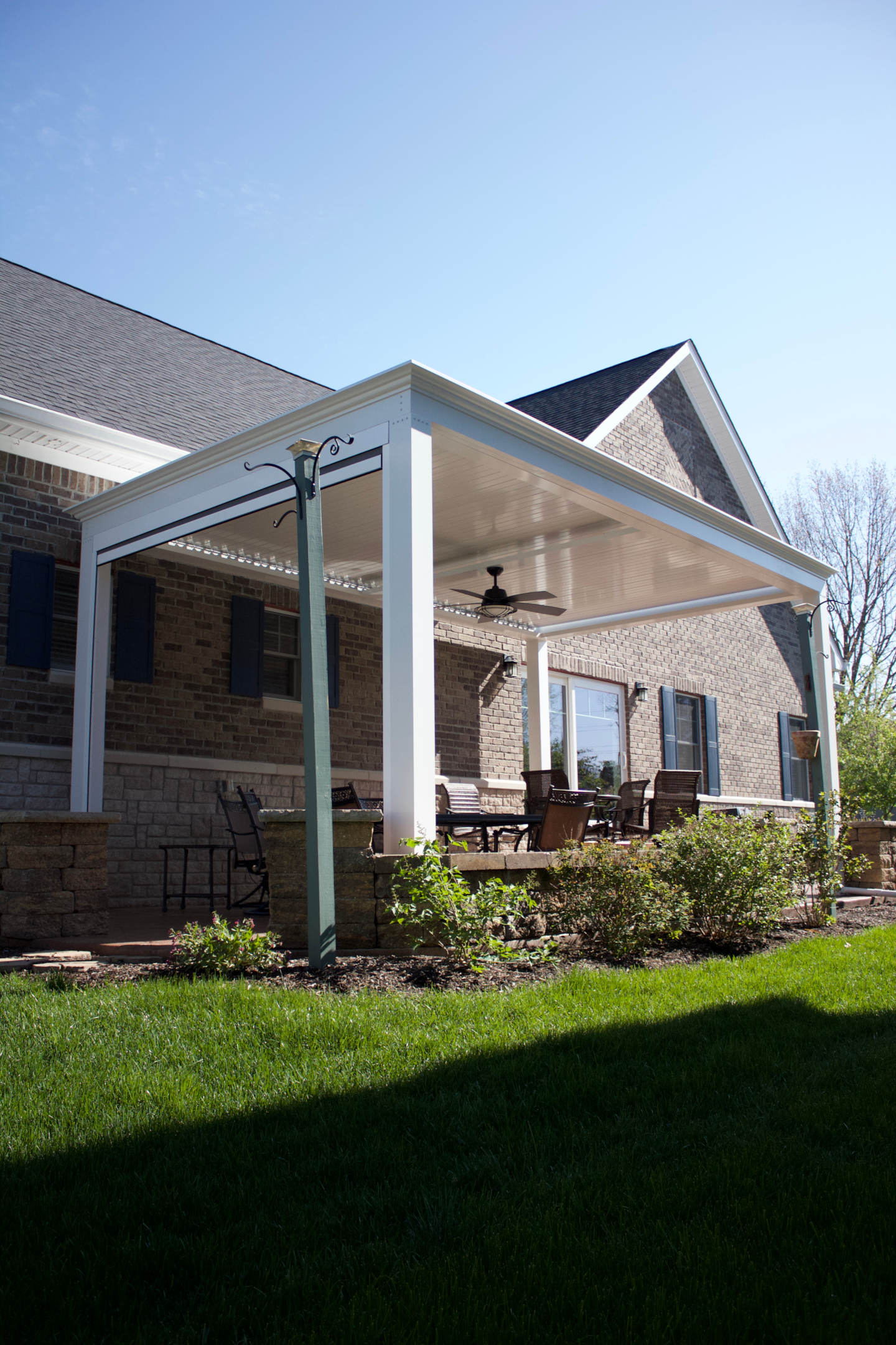 Patio covers can control the sun and provide shade, most times of the year.  Make sure your pergola has an integrated gutter system for drainage purposes.