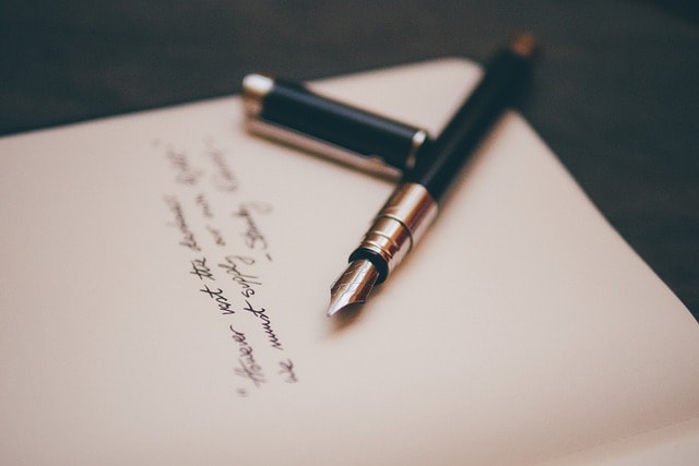 A notebook and a pen.