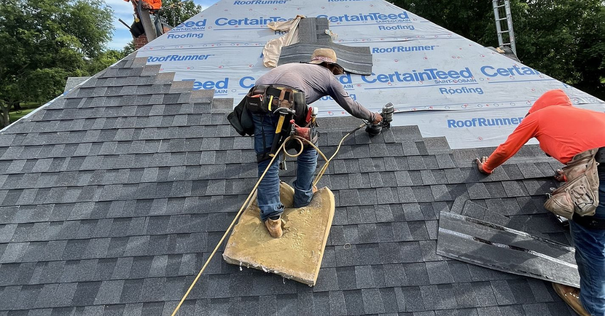 Roofing contractors carefully nailing new CertainTeed shingles during a roof installation in Nashville, TN, ensuring quality, safety, and long‑term durability.