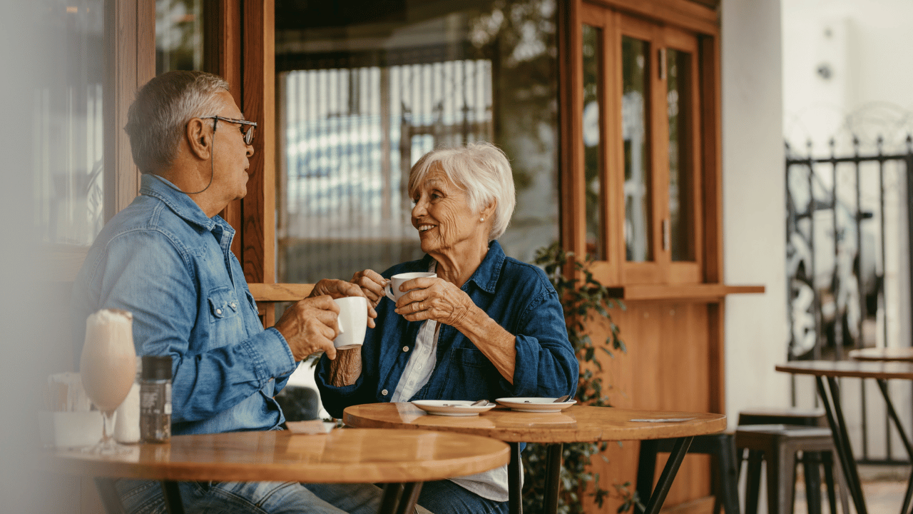 A senior couple discussing the benefits of hiring an elder law attorney