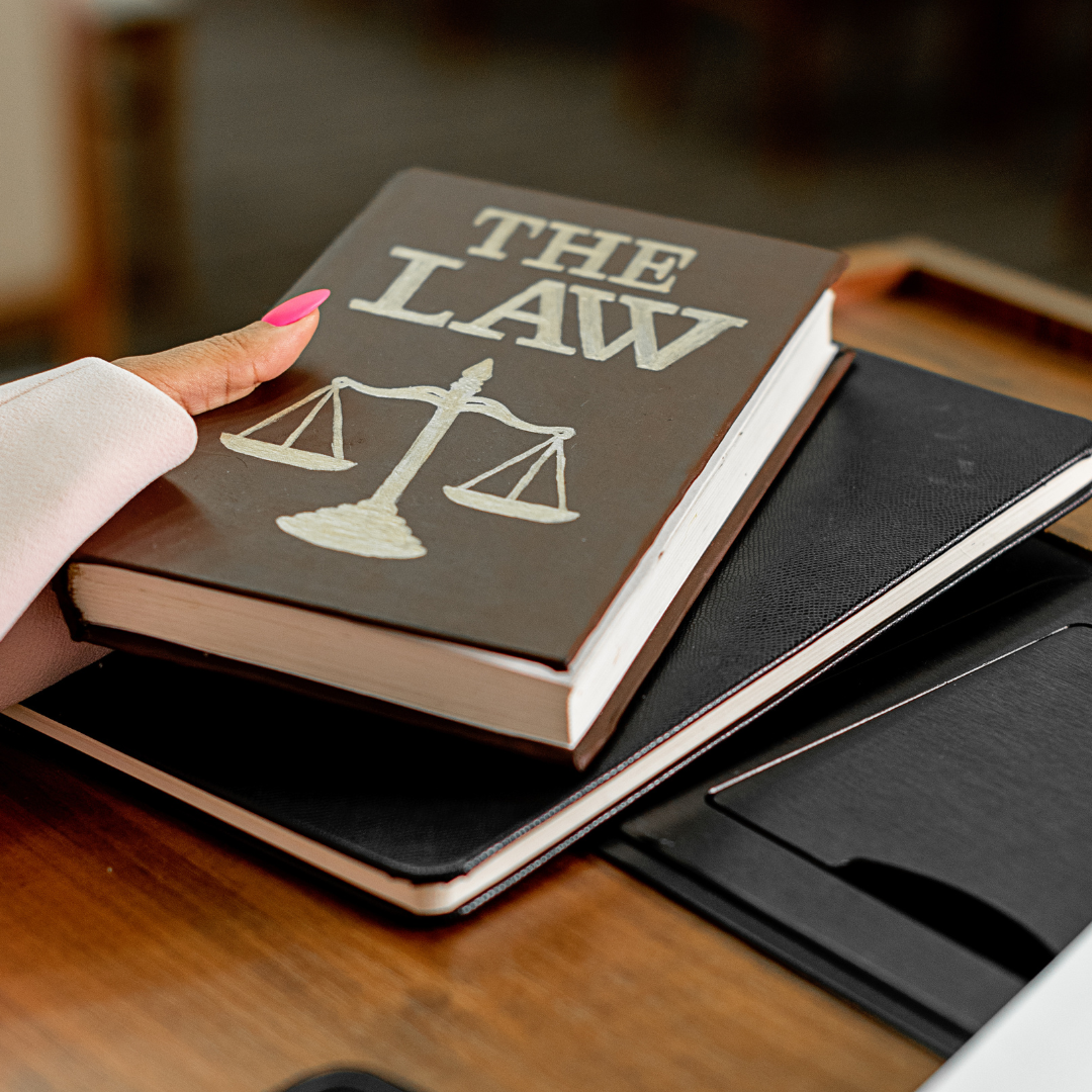 Law book being placed down on a table