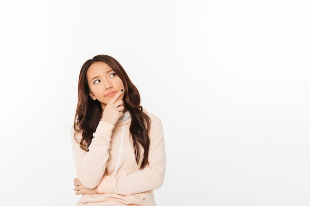 Asian woman thinking about Feather insurance