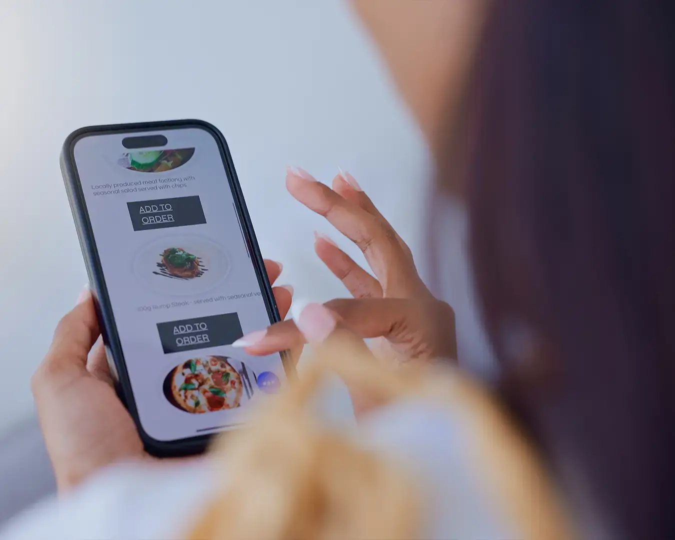 Online restaurant ordering on smartphone with menu items and direct order options