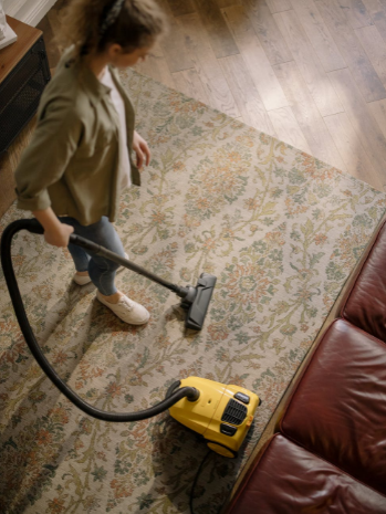 woman holding vacuum cleaner