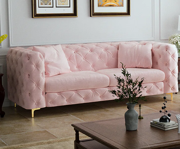 light pink tufted sofa in velvet fabric