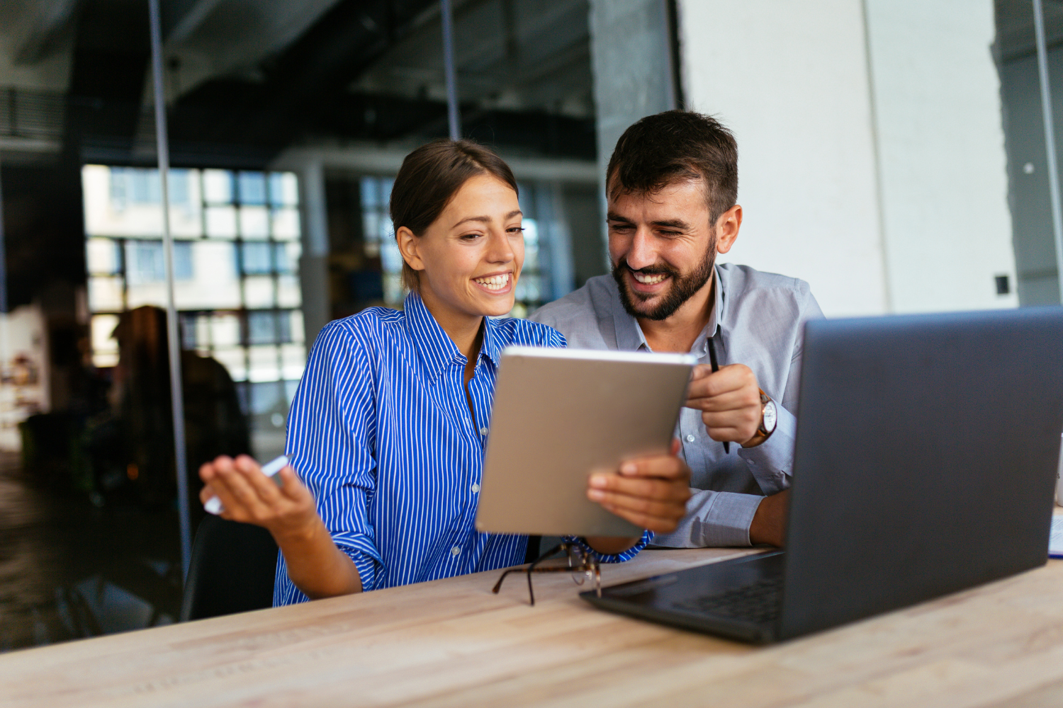  A manager and an employee reviewing a performance improvement plan.