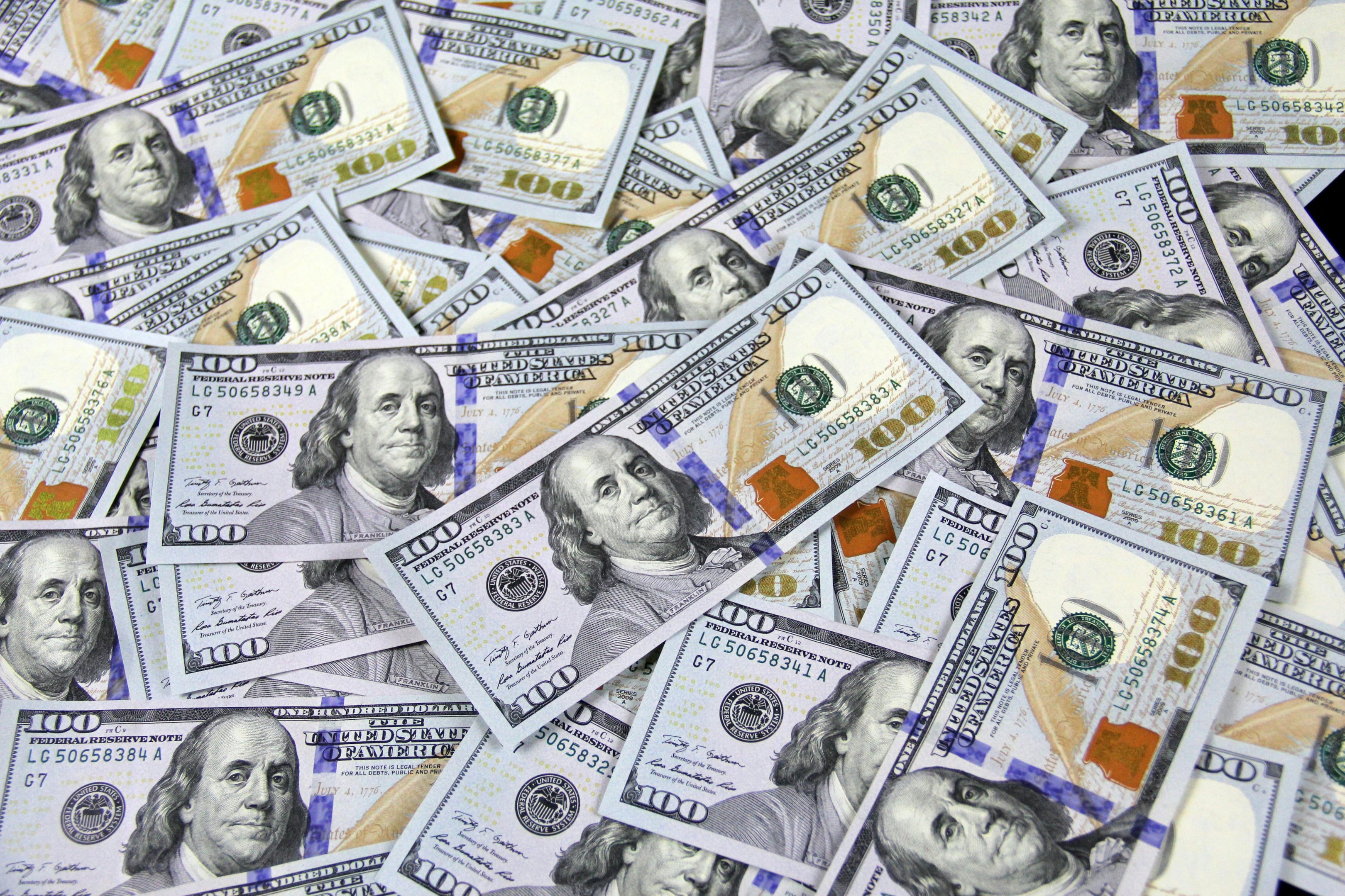 Pile of one hundred dollar bills.