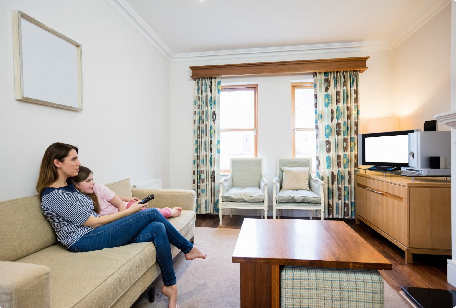 Mother and daughter watching TV in living room - https://www.freepik.com/free-photo/mother-daughter-watching-tv-living-room_1008972.htm#fromView=search&page=1&position=15&uuid=9e583146-4f77-4d3f-bbca-6c16288c2500&query=living+room+ceiling+uk