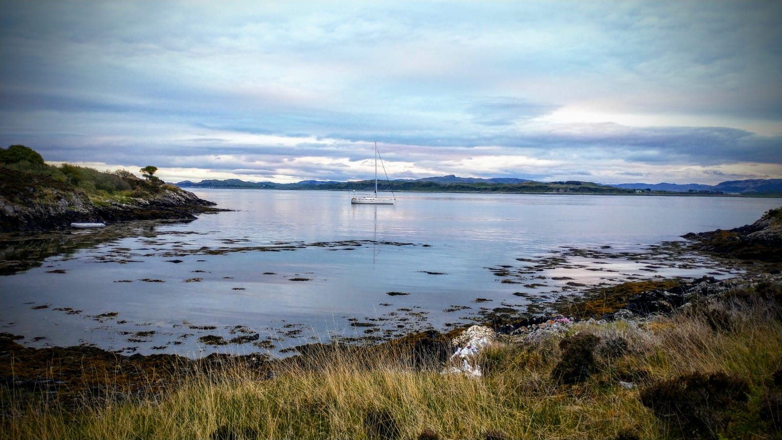Anchored in a tranquil remote bay amongst the inner Hebrides.