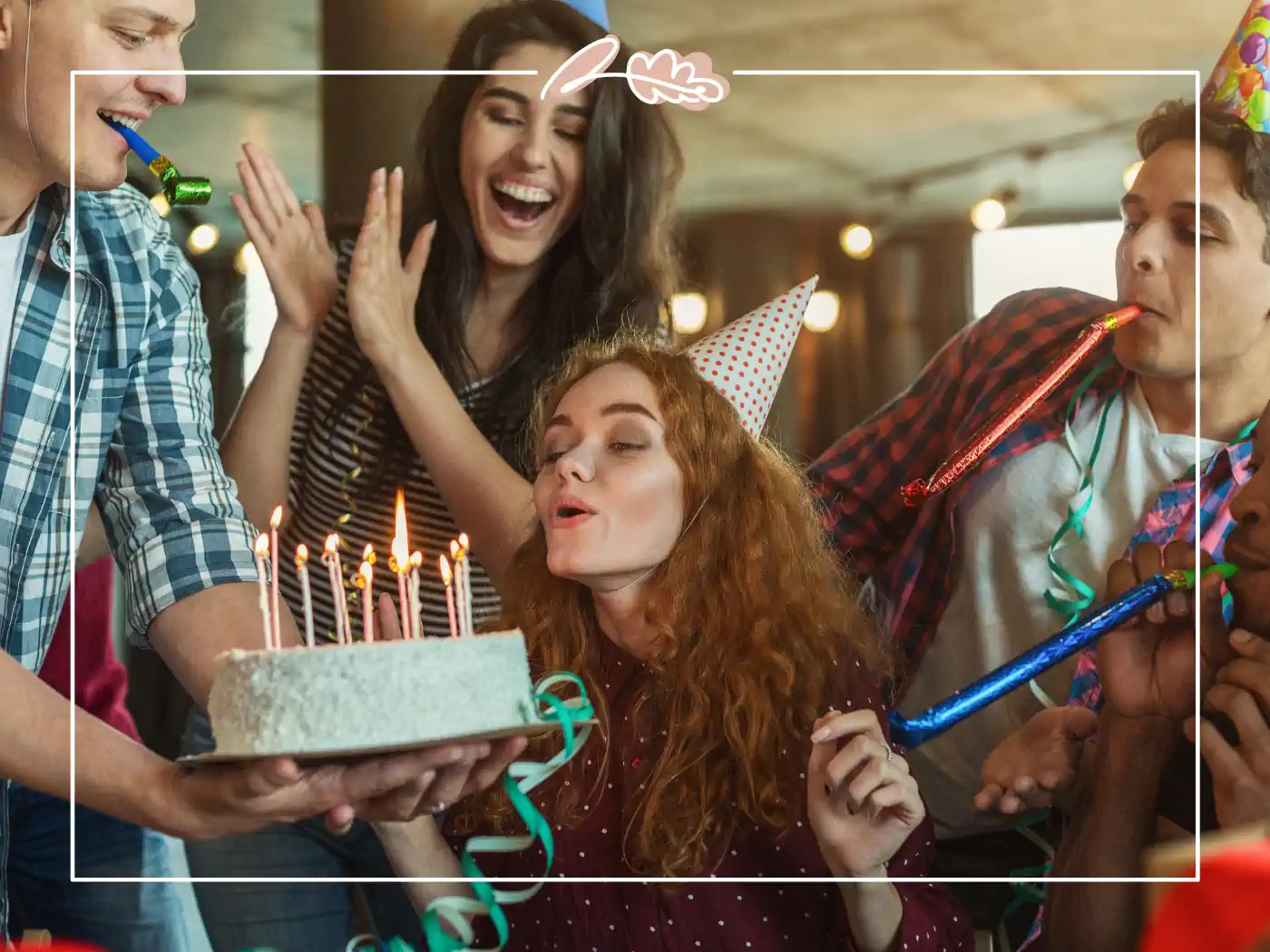 A woman blowing out birthday candles on a cake, surrounded by friends at a lively celebration. Happy birthday wishes. Fabulous Flowers and Gifts.