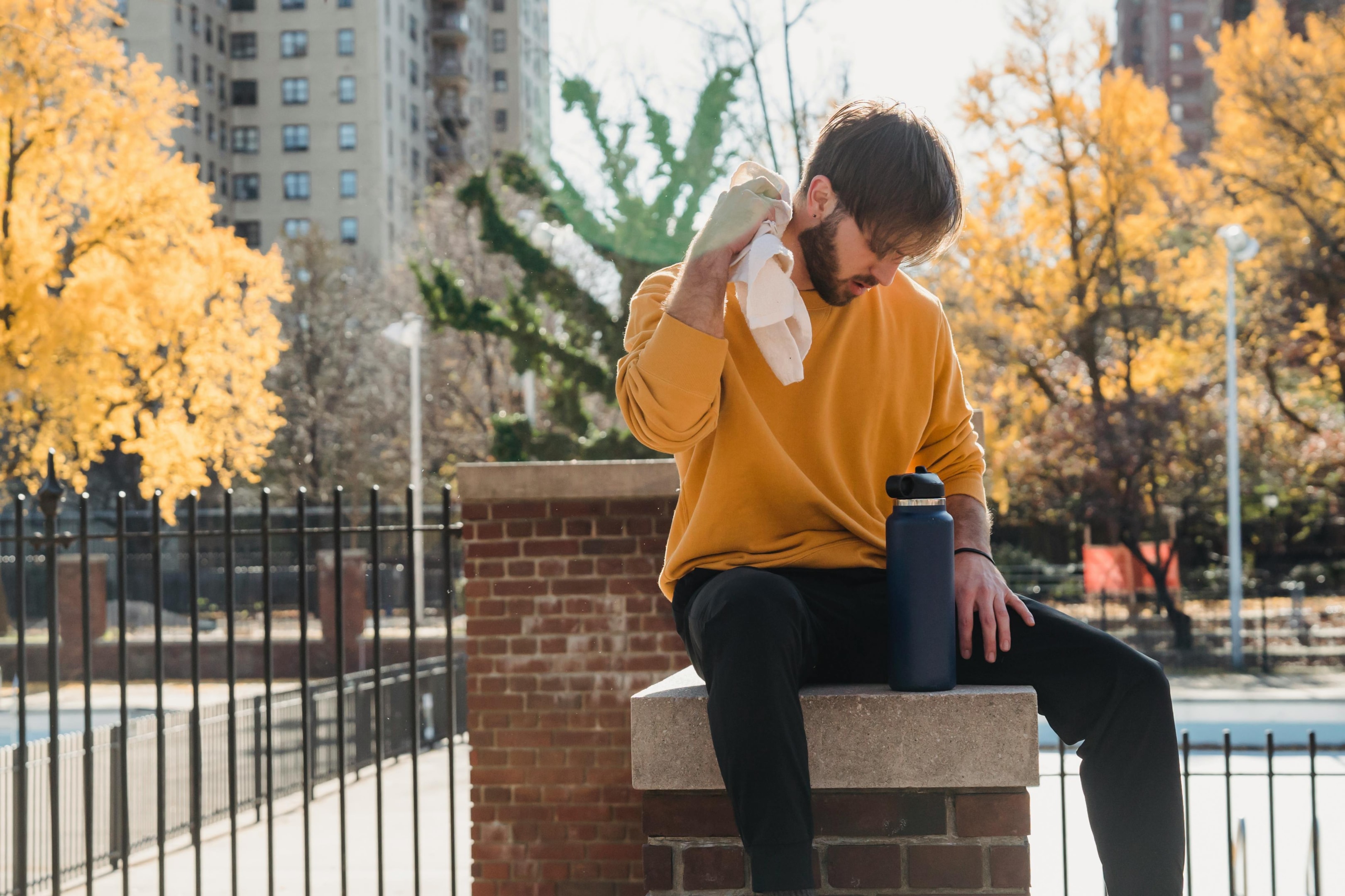 Photo by Mary Taylor: https://www.pexels.com/photo/tired-sportsman-sitting-on-post-with-bottle-of-water-6009257/