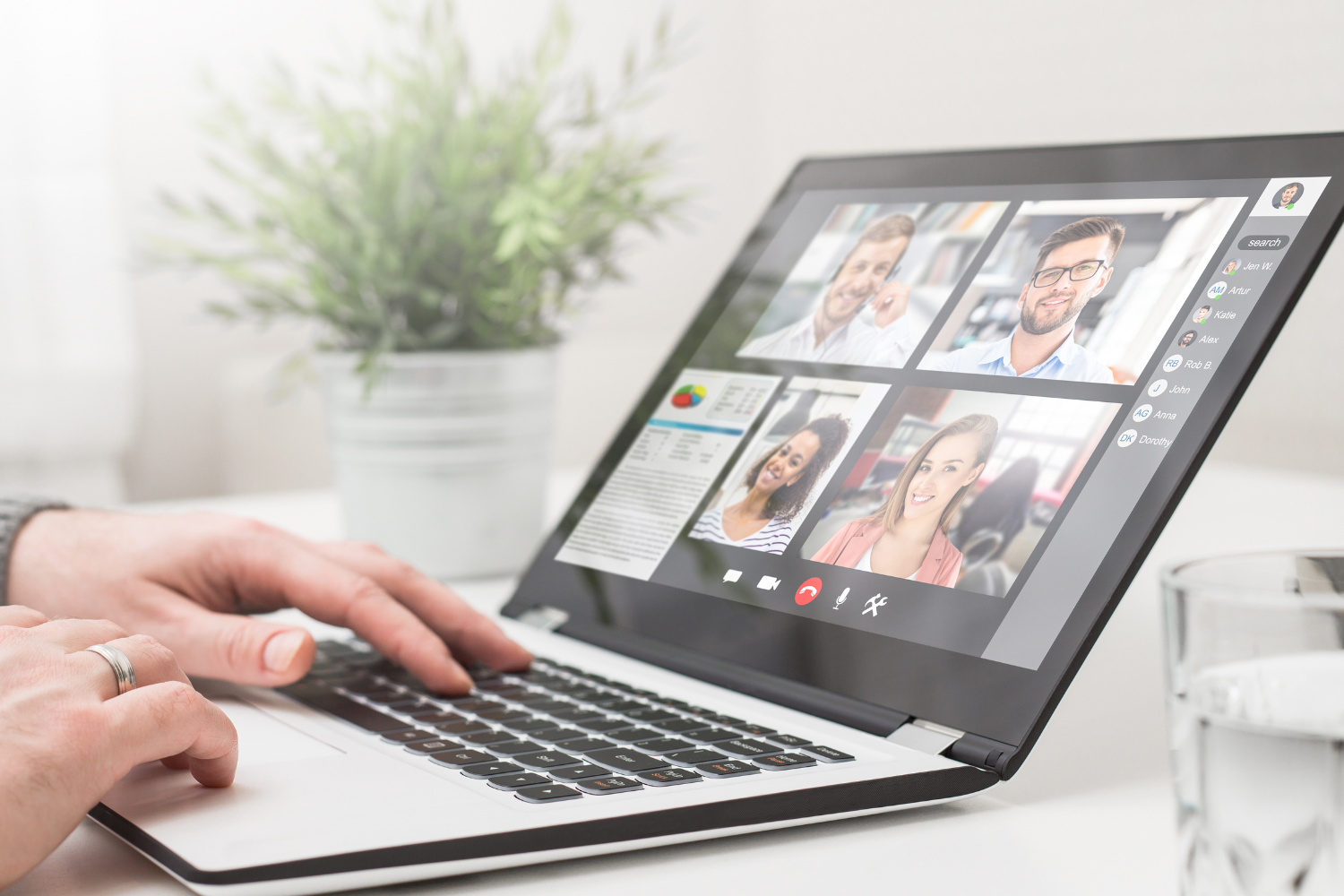 Team video call shown on laptop screen.