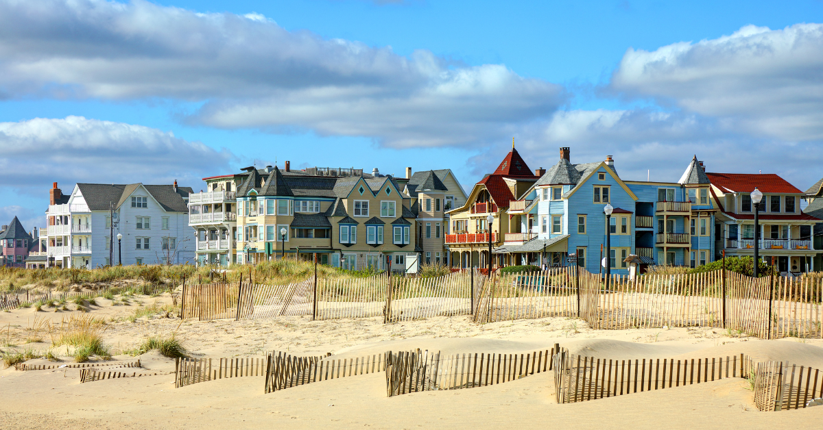 Colorful Victorian houses along the shoreline, showcasing the charm of Ocean Grove beach rentals and Ocean Grove summer rentals.