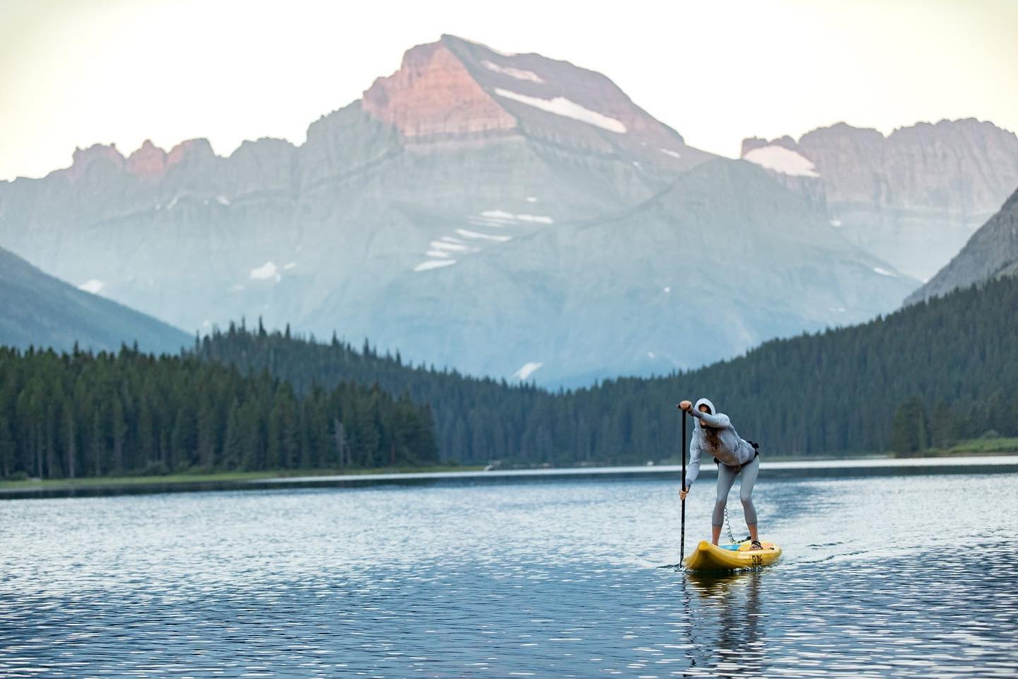 standup paddle board on a mountain lake