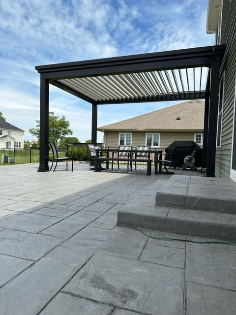 Beautiful aluminum pergola engineered to handle whatever wind and snow loads you may encounter.  Use reputable contractors and get a solid warranty.