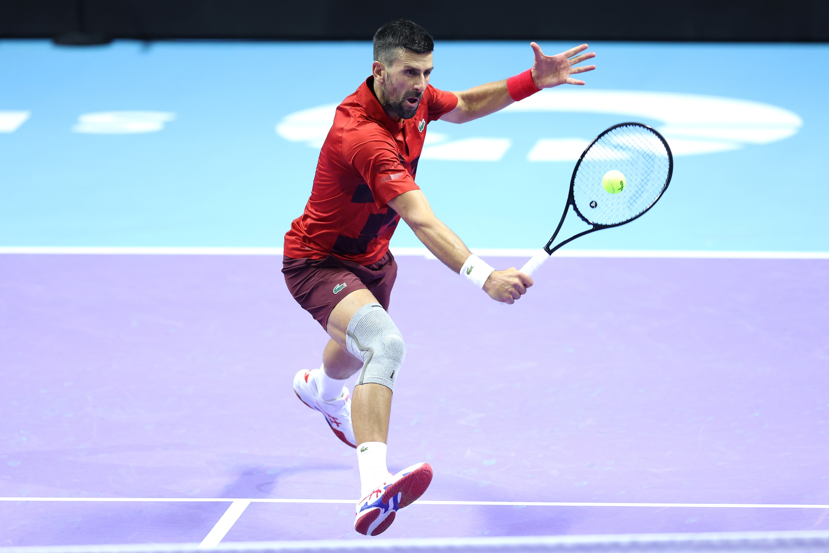 Novak Djokovic of Serbia plays a backhand in his Semi Final match against Jannik Sinner of Italy during the Six Kings Slam 2024 at Kingdom Arena on October 17, 2024 in Riyadh, Saudi Arabia. 